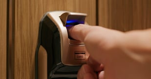 man-use-of-fingerprint-door-lock-PMXJBV4